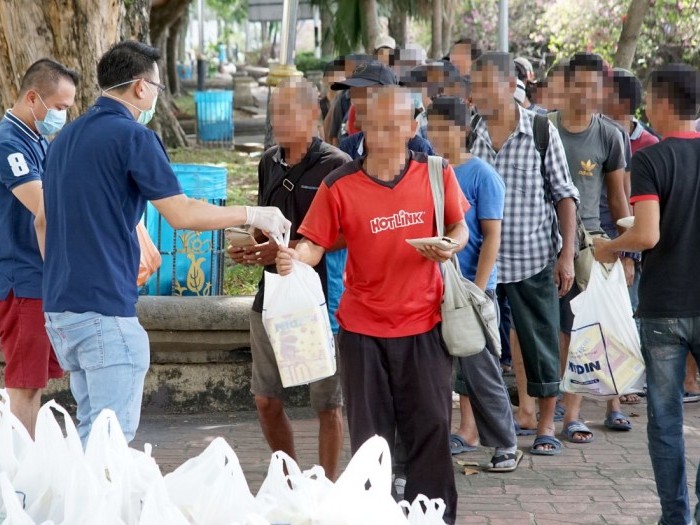 NGO Giving Items to Homeless People 