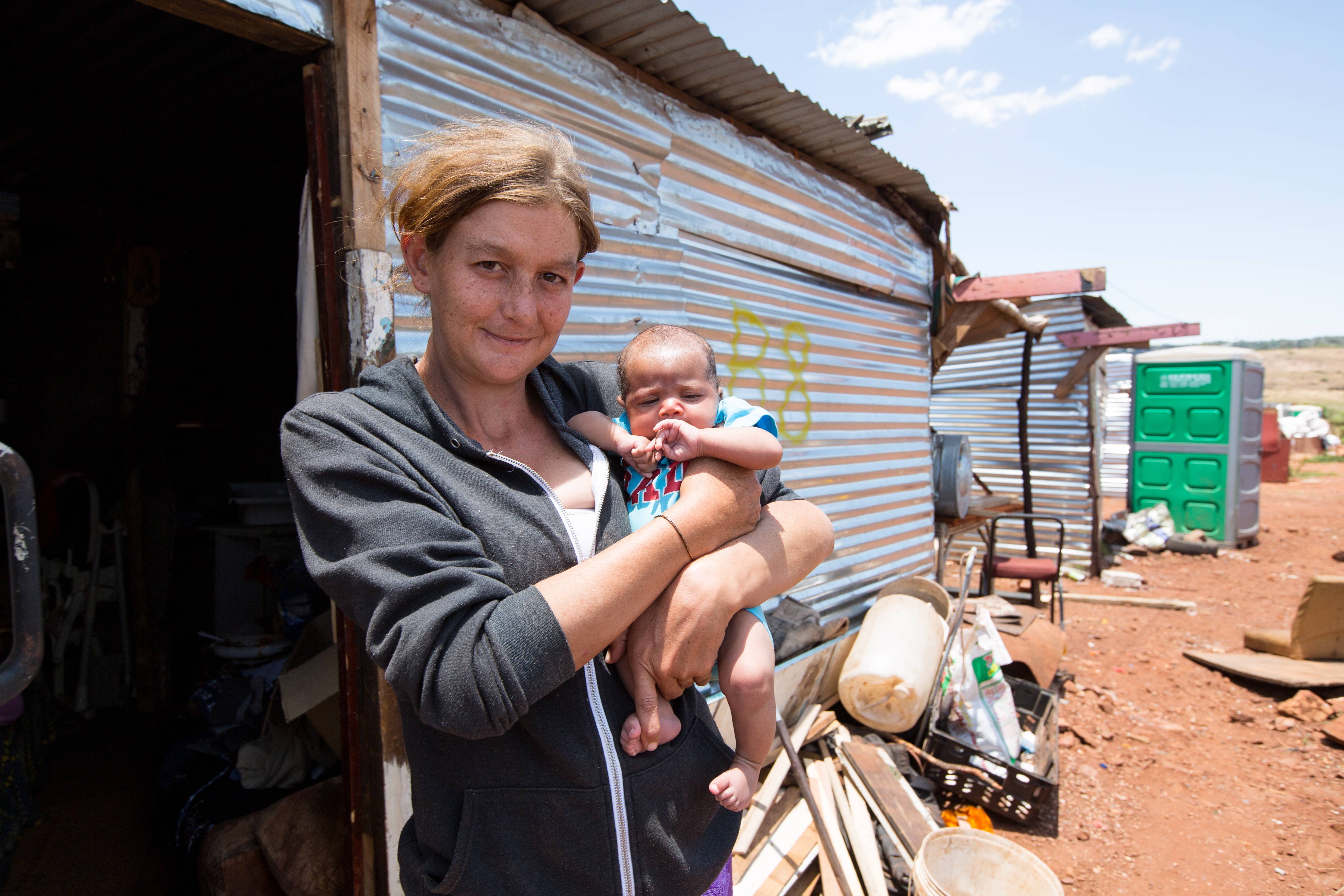 Poor White Mother with Baby in South Africa's Squatter Camp